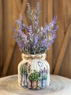 a jar with lavender flowers painted on it