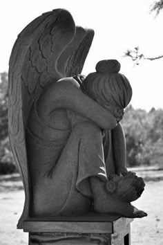 black and white photograph of an angel statue