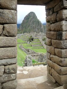 an open doorway leading to the ruins at machu picchu