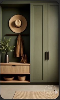 a hat is hanging on the wall next to a green cabinet