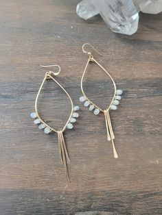 So in love with these Moonstone Tulip Earrings! These beauties are abstract art pieces of tulips that you can wear and take with you on your adventures! They are the perfect addition to your Spring/Summer jewelry and they go with just about anything! They are available in Sterling Silver and 14K Gold Filled. Each piece is hand formed and hammered for texture and shape. Four beautiful Moonstone Gems are wire wrapped up each side of the earring. The length of the earrings are just a tad over 3 in. Bohemian Drop Pierced Earrings, Adjustable Teardrop Bohemian Wrap Earrings, Bohemian Teardrop Wrap Earrings, Bohemian Nickel-free Drop Jewelry, Bohemian Teardrop Crystal Earrings For Pierced Ears, Dainty Nickel-free Moonstone Earrings, Unique Teardrop Earrings With Ear Wire, Unique Teardrop Hoop Earrings For Everyday, Dainty Moonstone Earrings Nickel Free