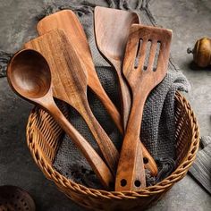 wooden utensils in a basket on a table