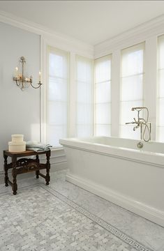 an image of a bathroom with white walls and tile flooring on the phone screen