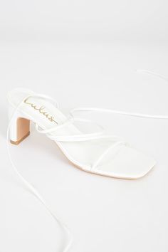 Get party-ready this season with the Lulus Aliah White Lace-Up High Heel Sandals! These cute and fun sandals feature a sleek faux leather composition that shapes a trendy, square toe upper and footbed with a strappy vamp atop a sturdy block heel. Long lace-up ties wrap around above the ankle to create a versatile look that pairs with anything in your closet! 2. 75" wrapped block heel. Cushioned insole. Rubber sole has nonskid markings. All Man Made Materials. Imported. Lulus | Aliah White Lace-U Fun Sandals, Nice Sandals, Got Party, Lace Up High Heels, Sandal Heels, Tie Wrap, Leather High Heels, Heel Sandal, Heel Sandals