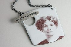 a dog tag with an image of a woman's face on it