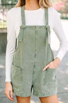 These overalls are just so cute and casual! They are going to look so fun to style! you can pair this linen overalls with tees or tanks in the summer, with long sleeve tops or bodysuits in the fall! Square neckline Adjustable tied straps Pockets Denim fabric No stretch London is wearing the small. Olive Green Overalls Outfits, Trendy Green Cotton Overalls, Green Casual Cotton Overalls, Sage Green Overalls, Green Relaxed Fit Overalls, Peach Clothes, Stylish Fits, Linen Overalls, Vintage Mom