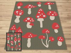 a rug with red mushrooms on it and a gray floor mat next to the image