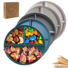 an assortment of candies, nuts and chocolates in a divided tray