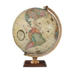 an old world globe on a wooden stand