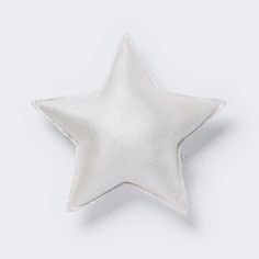 a white star ornament on a white background with clippings to the side