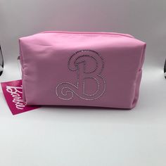 Barbie The Movie X Crocs Pink Toiletries Jewel Logo Make-Up Bag Nwt 73. Nwt. Cute Pink Satin Feeling Bag With The Name In “Jewels”. It Looks Like One Stone Is Missing But It Came To Me That Way And There Is No Mark On The Material Where It Looks Like It Fell Off So I Think It’s Supposed To Be That Way But Not Sure. I Just Wanted To Make You Aware. This Bag Measures Approximately 7 X 4.5 X 4”. Please View All Photos Carefully As They Are Part Of The Description As Well. Comes From A Clean Smoke F Jewel Logo, Crocs Pink, Barbie The Movie, Stationery Business, Women's Crocs, Make Up Bag, Cute Bags, It's Fall, Logo Color