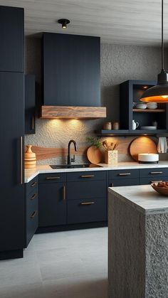 a modern kitchen with black cabinets and counter tops, an island in the foreground