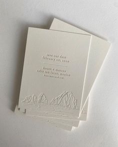 three white cards with the words save our date printed on them