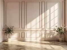 an empty room with two vases and flowers on the floor