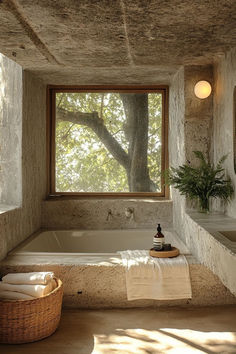 a bathroom with a large window and stone walls