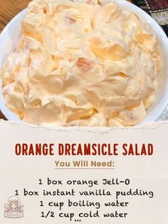 an orange creamsice salad in a white bowl