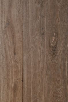 a cat laying on top of a wooden floor