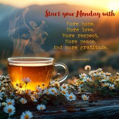 a cup of tea sitting on top of a wooden table next to daisies and the words start your monday with more love, more love, more respect, more peace, more peace, and more peace, and more grateful