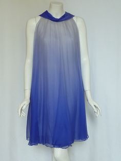 "Exquisite & Rare!!  FLORILEGE BALMAIN Vintage late 50s/early 60s Silk Georgette Ombré Chiffon Trapeze Dress!! This luxe vintage frock is styled with a loosely gathered trapeze silhouette from the neck, with a modified scarf cowl neckline in royal cerulean blue that sends diaphanous ombré flyaway neck ties down the back; tie them, loop them or just let them drape freely! There is a sheath underdress that is also covered in a layer of the ombre silk chiffon. The delicately textured silk chiffon t Blue Sheer Silk Dress, Blue Sleeveless Silk Chiffon Dress, Blue Chiffon Evening Dress For Summer, Blue Silk Chiffon Summer Dress, Summer Sheer Silk Chiffon Dress, Blue Vintage Chiffon Dress, Blue Silk Chiffon Dress, Blue Silk Chiffon Evening Dress, Blue Chiffon Cocktail Dress