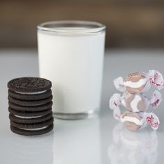 a glass of milk and some cookies on a table