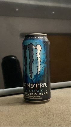 a can of monster energy drink sitting on top of a counter