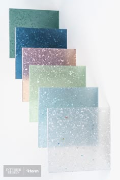 five different colors of glass with speckles on them