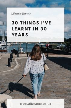 a woman walking her dog down the street with text overlay reading 30 things i've learn in 30 years