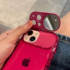 a person is holding an iphone case in their left hand and looking at the camera