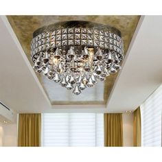 a chandelier hanging from the ceiling in a room