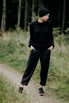 BOOI - black woollen trousers. The cut is quite wide. Tapered legs are ideal for rolling up and controlling the length this way. Rubber in the waist allows wearing the trousers both on the hips and in the waist. Pockets on the sides. The trousers are made of black wool that is slick and doesn't irritate the skin. They reflect light beautifully. Because of the addition of elana and lycra, the trousers don't crease easily and are easy to maintaint. Color: black Fabric: 100% wool Made in Belgium. Black Wool High-waisted Wide Leg Pants, Black High-waisted Wool Wide Leg Pants, Oversized Wide Leg Pants For Fall Workwear, Casual Black Wool Bottoms, Chic Black Wool Wide Leg Pants, Black Wide Leg Pants With Loose Fit For Winter, Fall Season Wide Leg Trousers, Black High-waisted Wide Leg Pants For Fall, Black Wool Pants For Winter