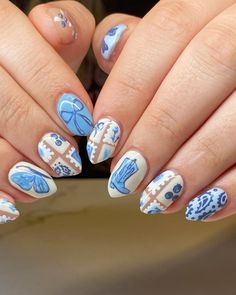 These nails feature a delicate blue and white design, reminiscent of refreshing summer skies and beach waves.  🌸Click on the image to shop our trending Korean Gel Polish this season.  🌸Credit: marissa__nails on Instagram 🌸Summer nails, blue nails, white nails, beach nails, sky nails, summer nail design, Korean gel polish, trending nails, floral nails, elegant nails, nail art, summer vibes, fresh nails, manicure, nail inspiration, summer manicure, gel nails, nail trends, stylish nails, hand-painted nails. Blue Mismatched Nails, White Nails Beach, Korean Gel Polish, Manicure Gel Nails, Quilted Nails, Pink Tulle Prom Dress, Book Nails, Country Nails