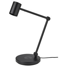 a black desk lamp on a white background