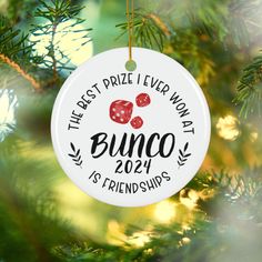 a christmas ornament hanging from a tree with the words, the best prize ever won