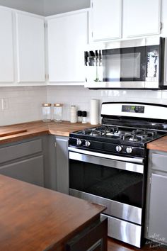 a stove top oven sitting inside of a kitchen