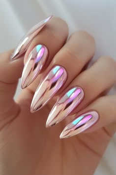 a woman's hand with pink and silver nails