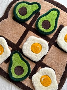 an avocado and egg rug on a bed