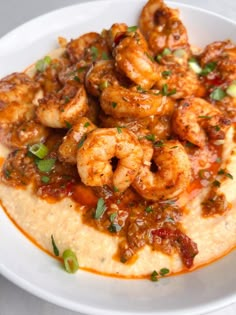 the best southern shrimp and grits recipe on a white plate with text overlay