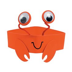 an orange paper box with eyes and legs