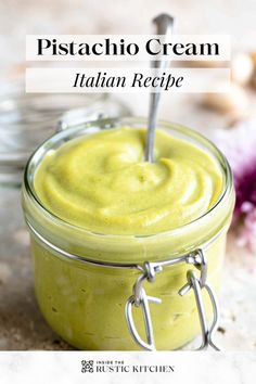 a close up of a jar of pistachio cream with a spoon in it