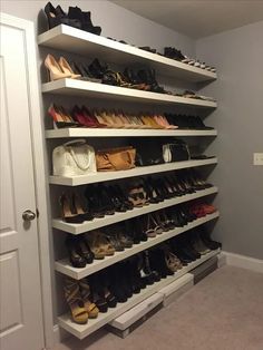 the closet is full of shoes and purses