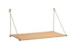 a wooden shelf with two brass handles on the bottom and one hanging from it's sides