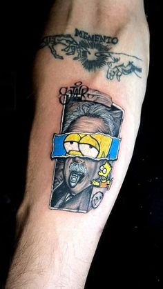 a man's arm with a cartoon character on it and the words mike from the simpsons