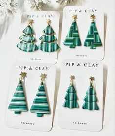 four christmas tree shaped pins and clips in different colors