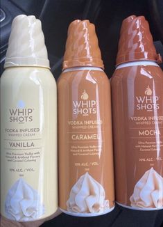 three different types of whipped cream in bottles