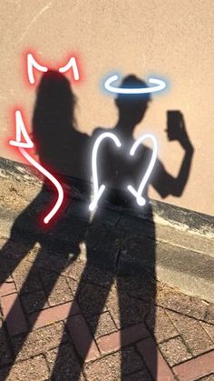 the shadow of a person holding a cell phone