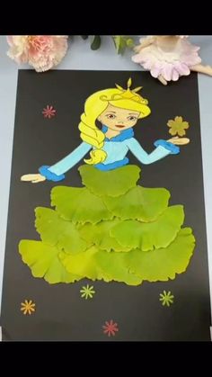 a paper cut out of a princess sitting on top of flowers