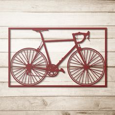 a red metal wall hanging with a bicycle on it