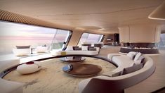 the interior of a luxury yacht with white furniture and large windows overlooking the water at sunset