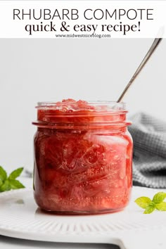 a mason jar filled with rhubarb compote and garnished with mint