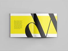 a yellow and black brochure with the letter q on it's side